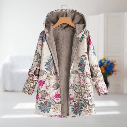 Veste à capuche doublée polaire, imprimé floral sur fond clair, fermeture zippée.