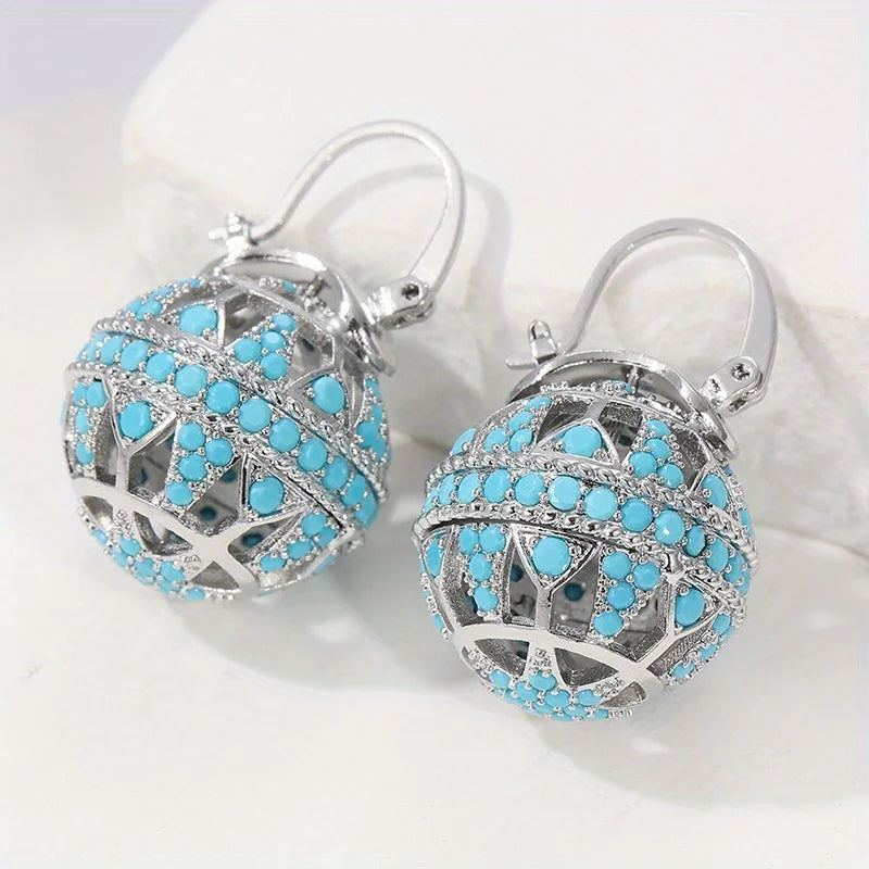 Boucles d’oreilles mandala turquoise argenté, sphères ajourées et perles bleu