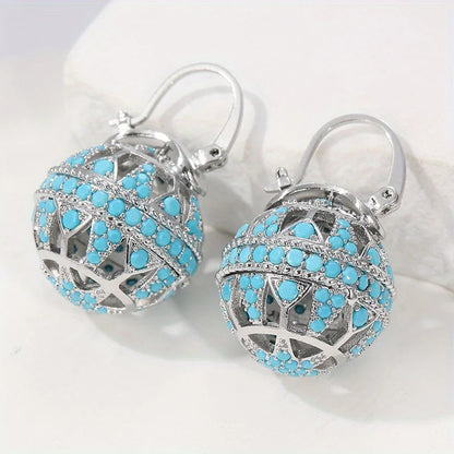 Boucles d’oreilles mandala turquoise argenté, sphères ajourées et perles bleu