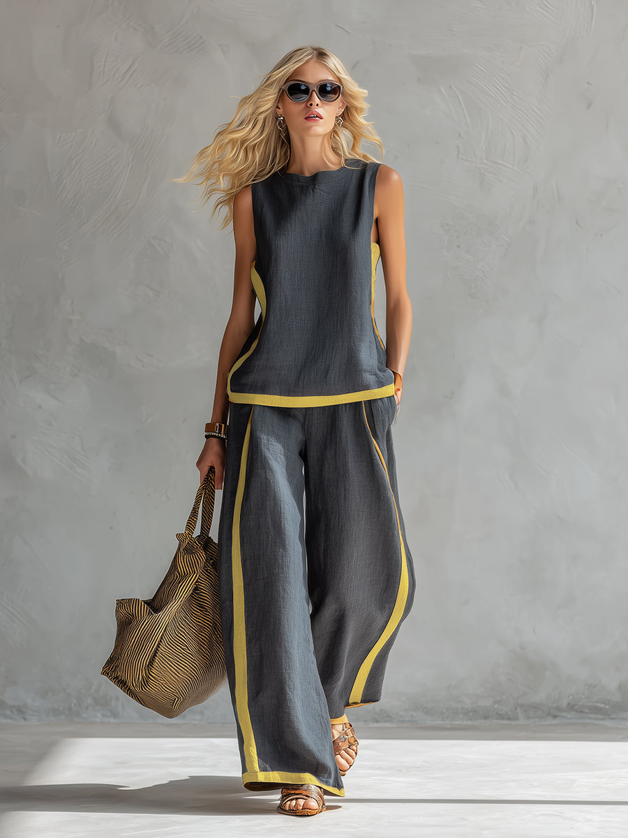 Ensemble deux pièces bleu marine : débardeur sans manches et pantalon long ample, bordure jaune