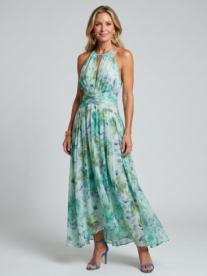 Robe longue plissée vert d’eau, encolure haute sans manches, motif floral