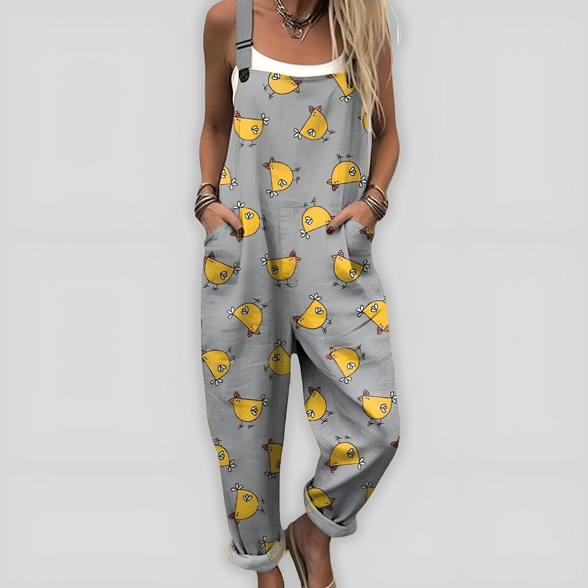 Combinaison ample sans manches gris, motif de petits poussins jaunes.