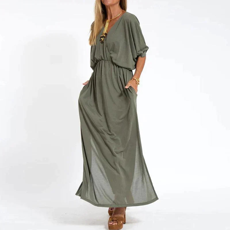 Robe longue vintage vert armée, manches 3/4 bouffantes, taille froncée, fente latérale.