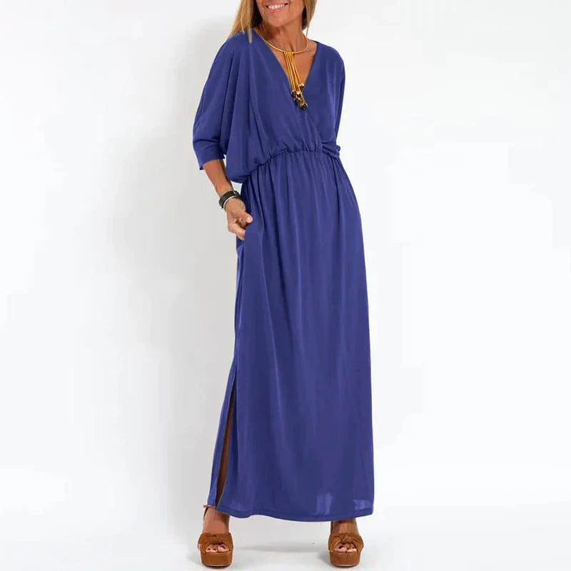 Robe longue vintage bleue, manches 3/4 bouffantes, taille froncée, fente latérale.