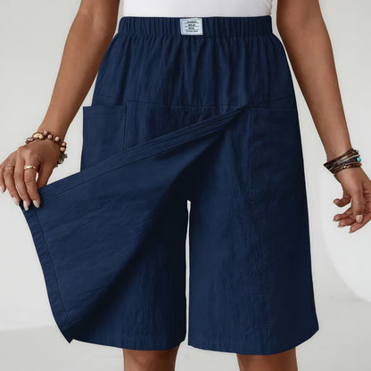 Jupe-short bleue à taille élastique, rabat frontal croisé et poches