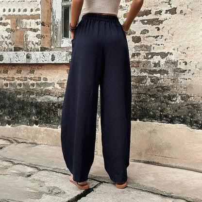 Pantalon fluide bleu marine à taille froncée, jambes larges, coupe ample
