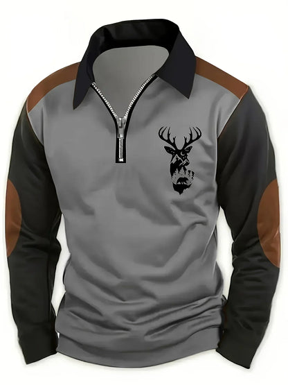 Pull col zippé gris, manches noires, motif tête de cerf et fermeture éclair décorée.