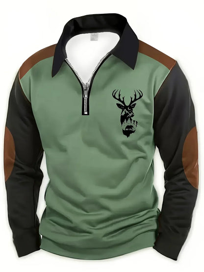 Pull col zippé vert, manches noires, motif tête de cerf sur la poitrine.