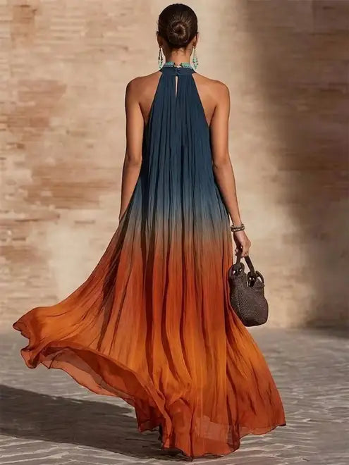 Robe longue dégradée halter, encolure V, tissu fluide bleu nuit vers orange