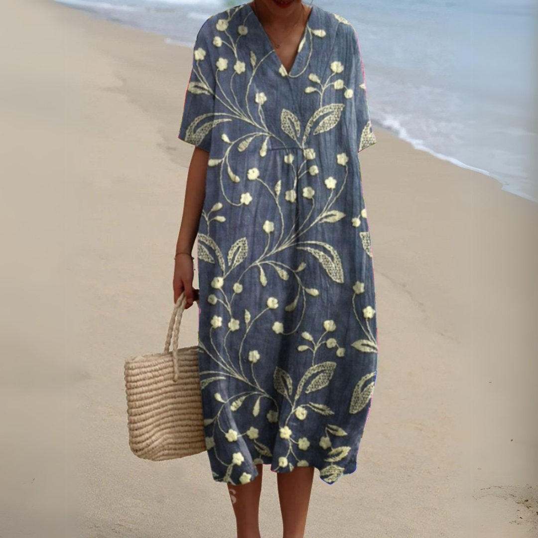 Robe mi-longue ample manches courtes, col V, motif floral doré sur fond bleu marine