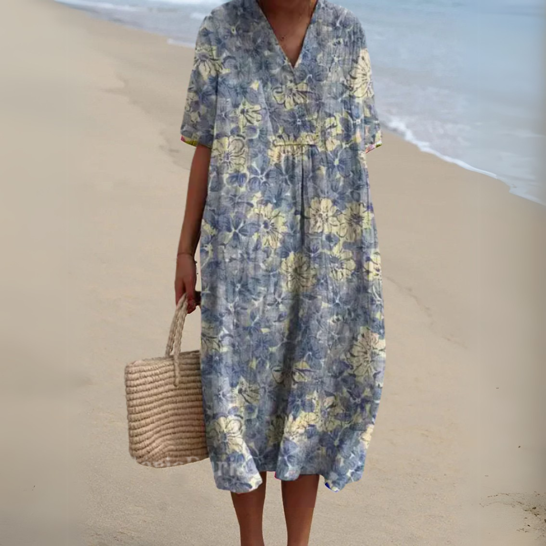 Robe midi bleue fleurie, manches courtes, encolure V, fronces à la taille