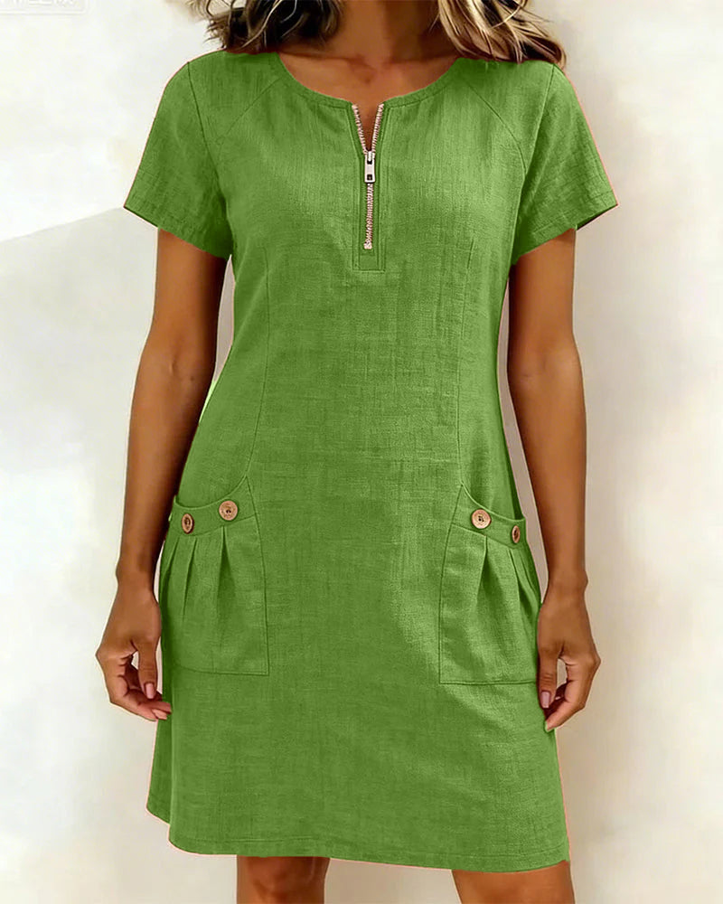 Robe courte verte avec fermeture éclair au col et poches latérales boutonnées