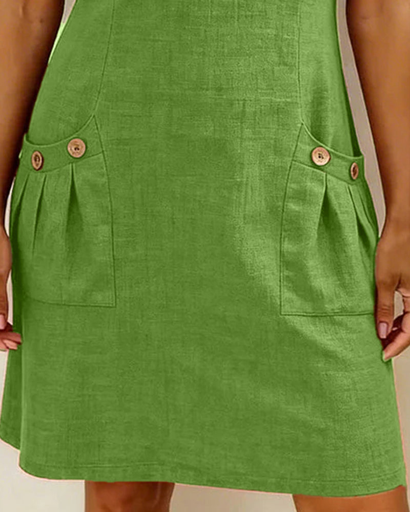 Robe verte courte avec poches à rabat et boutons, bas évasé