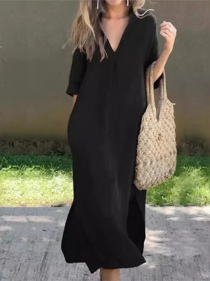 Robe longue décontractée noire, encolure en V, manches trois-quarts.