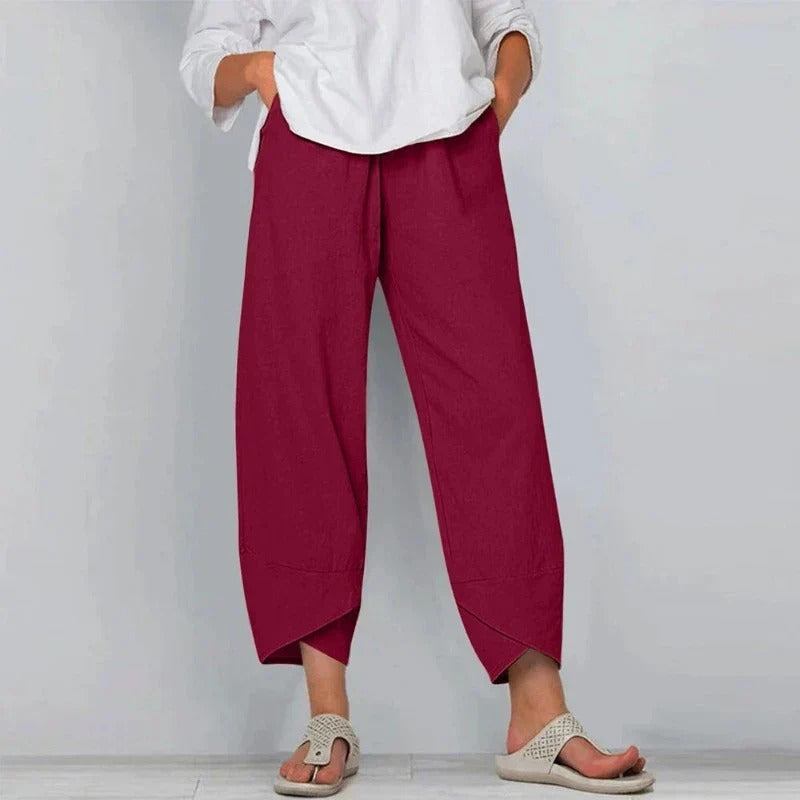 Pantalon d’été rouge bordeaux ample 7/8, taille élastique, ourlet asymétrique.