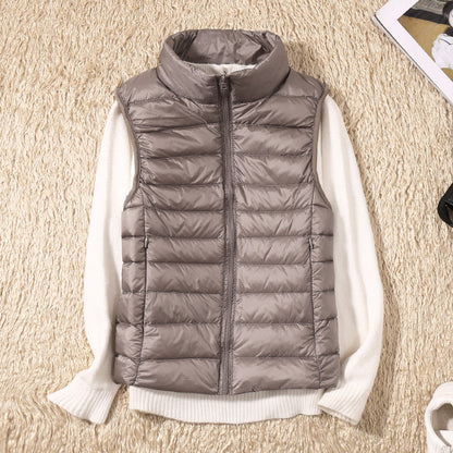 Gilet sans manches matelassé gris, fermeture zippée, col montant.