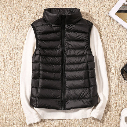 Gilet sans manches matelassé noir, fermeture zippée, col montant.