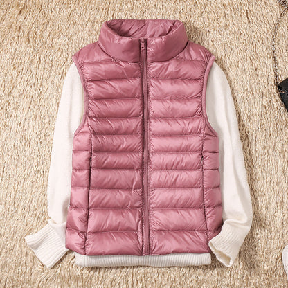 Gilet sans manches matelassé rose, fermeture zippée, col montant.