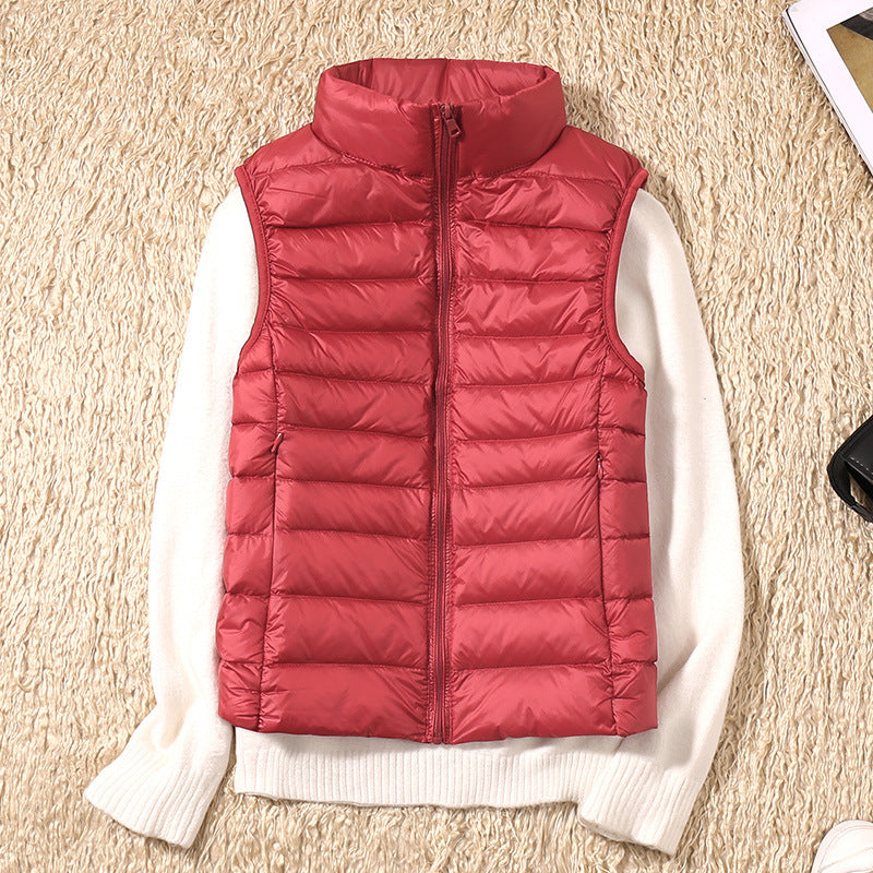 Gilet sans manches matelassé bordeaux, fermeture zippée, col montant.