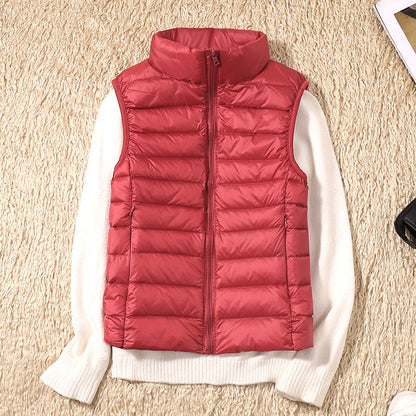 Gilet sans manches matelassé bordeaux, fermeture zippée, col montant.