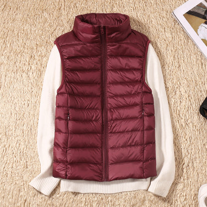 Gilet sans manches matelassé bordeaux, fermeture zippée, col montant.