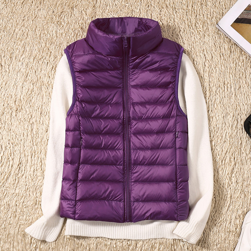 Gilet sans manches matelassé violet, fermeture zippée, col montant.