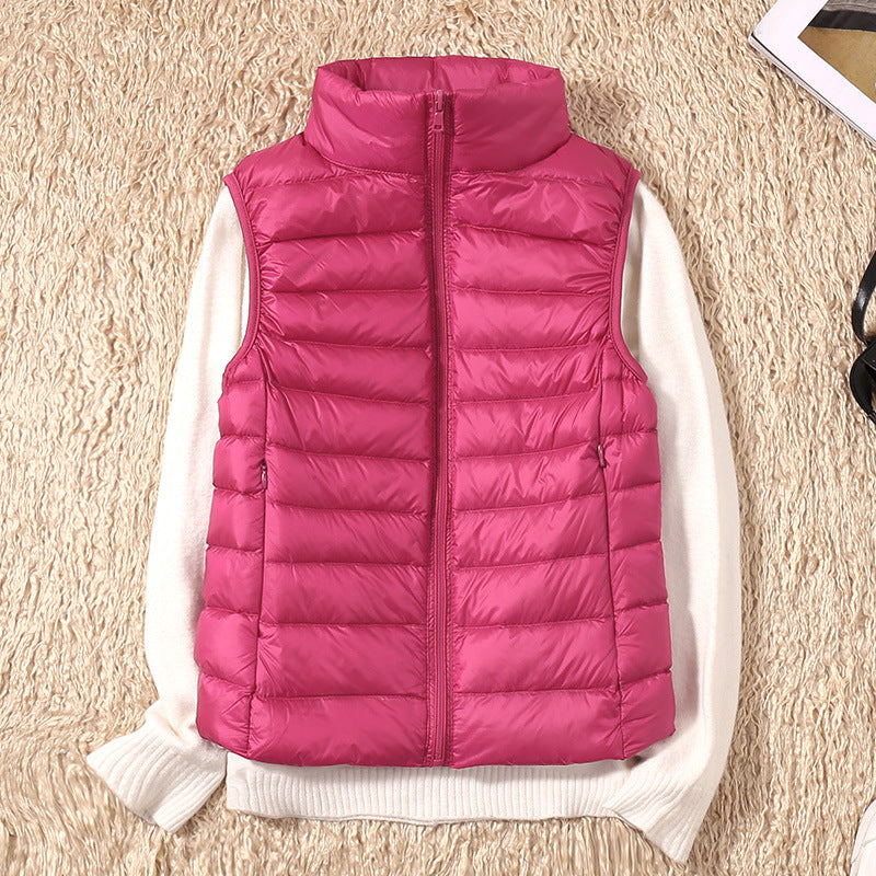 Gilet sans manches matelassé rose fuchsia, fermeture zippée, col montant.