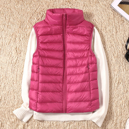 Gilet sans manches matelassé rose fuchsia, fermeture zippée, col montant.