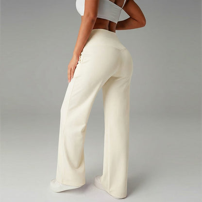 Pantalon femme à jambes larges et droites, taille haute. Tissu extensible