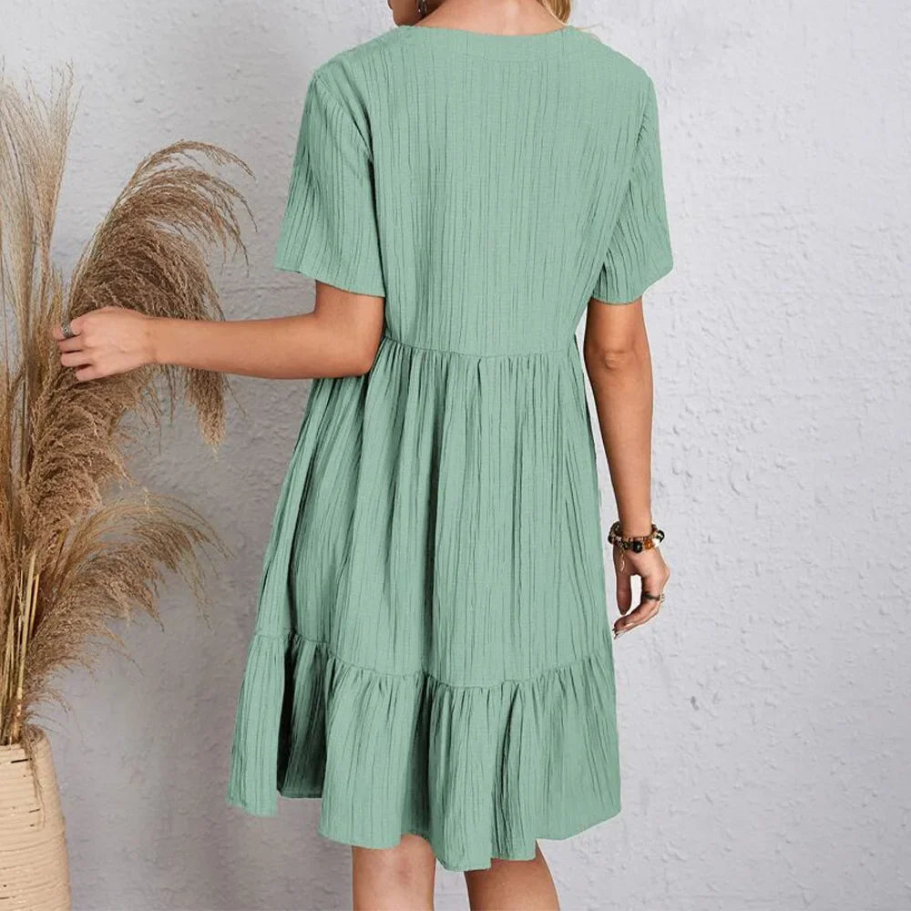 Robe décontractée verte à manches courtes et volants en bas, vue arrière