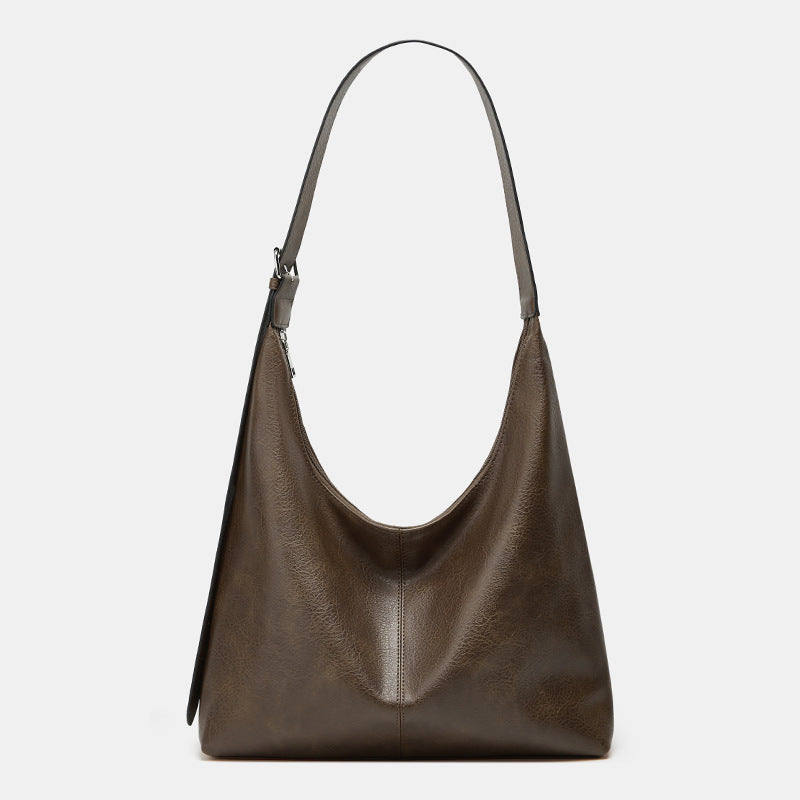 Grand sac seau en cuir taupe, anses courtes, surpiqûre centrale