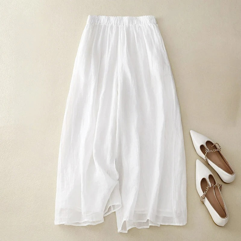 Pantalon en lin blanc à taille élastique, jambe ample et tissu léger