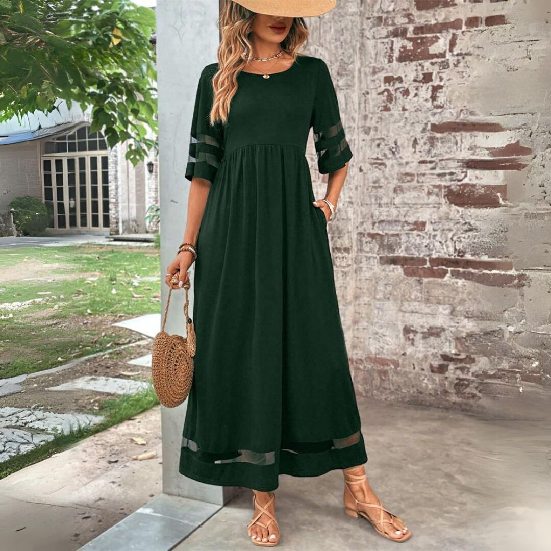 Robe midi verte, taille froncée, manches 3/4 à empiècements, ourlet contrasté