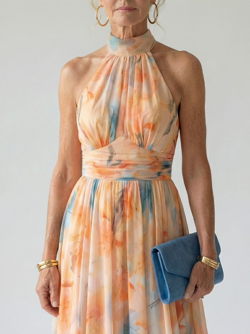 Robe mi-longue à licou, tissu fluide multicolore à motifs floraux abstraits.