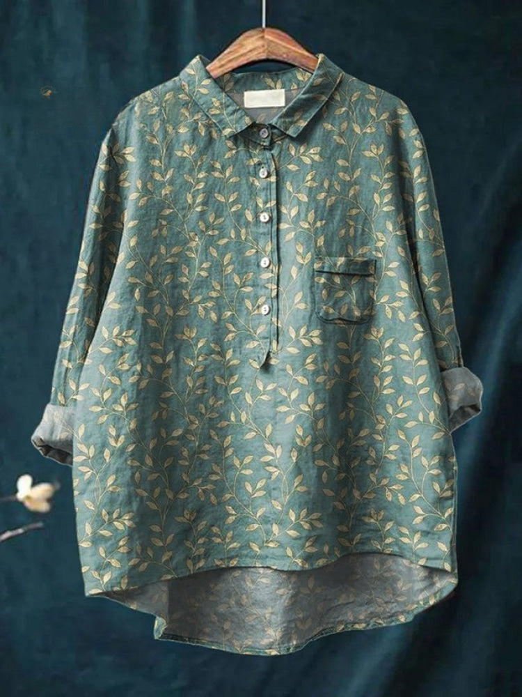 Chemise brodée fleurs sur fond vert foncé, boutonnée, col et poche poitrine