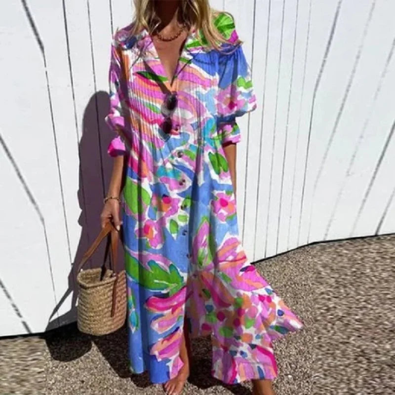 Robe bohème longue bleue multicolore, encolure V boutonnée, manches volant, fleurs.