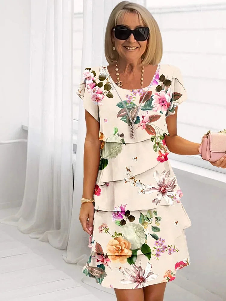 Robe courte à volants, imprimé floral coloré avec feuillages, fond clair, manches courtes
