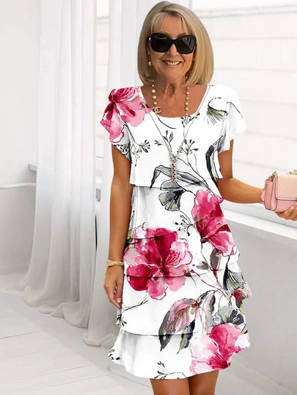 Robe courte à manches avec nœud, imprimé fleurs roses et magenta sur fond blanc