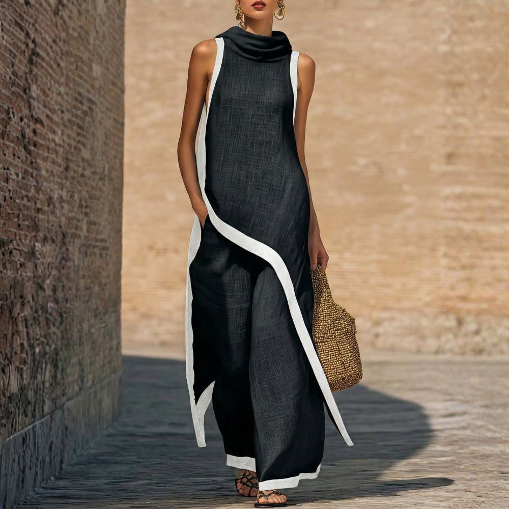 Robe longue en lin foncé sans manches, col drapé, bordures contrastées blanches.