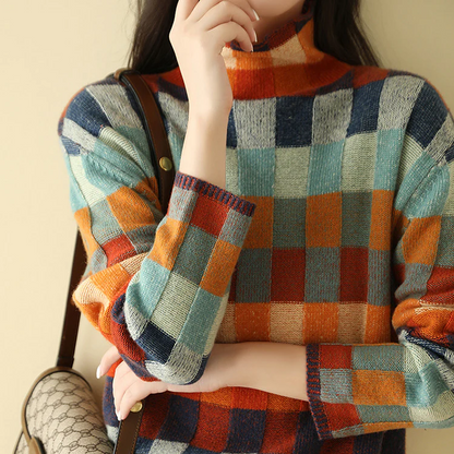 Pull en cachemire à col roulé, carreaux orange, bleu, vert et beige.