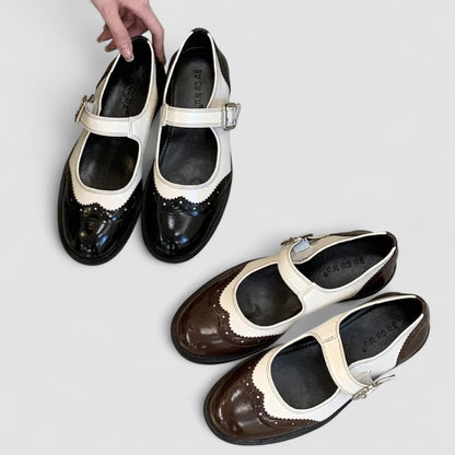 Chaussures de bébé contrastées Gabrielle™ noires et crème, bride à boucle et bout verni