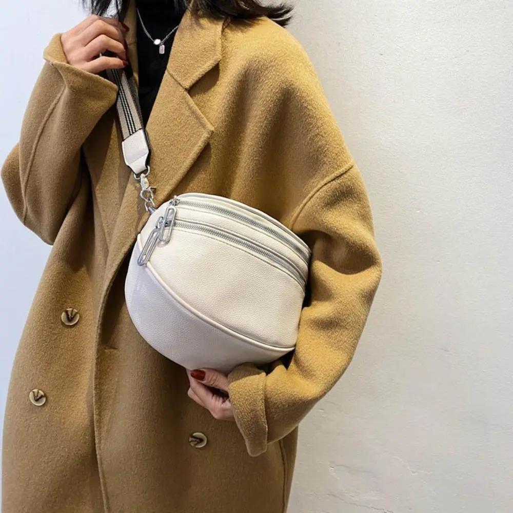 Sac à bandoulière blanc arrondi, double fermeture éclair et sangle réglable