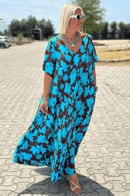 Robe longue ample bleue à fleurs, manches courtes et encolure en V, tombant fluide
