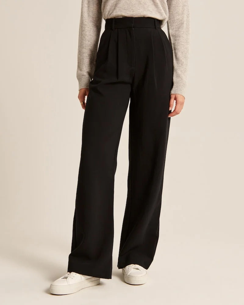 Pantalon noir ample à taille élastique, jambe droite et poches latérales