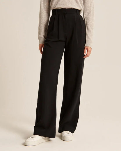 Pantalon noir ample à taille élastique, jambe droite et poches latérales