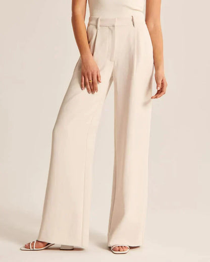 Pantalon ivoire taille haute, jambe ample, poches latérales et passants
