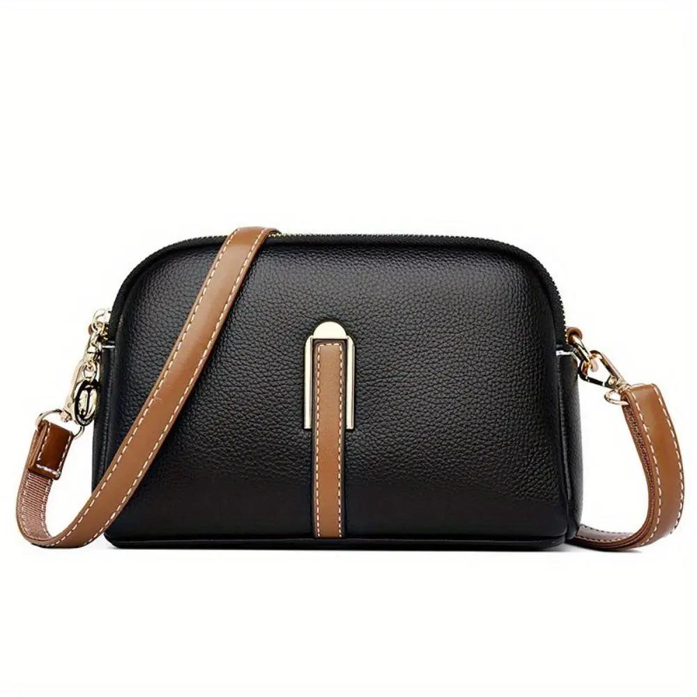 Sac bandoulière Sienne noir en cuir grainé, fermeture zippée, bandoulière marron