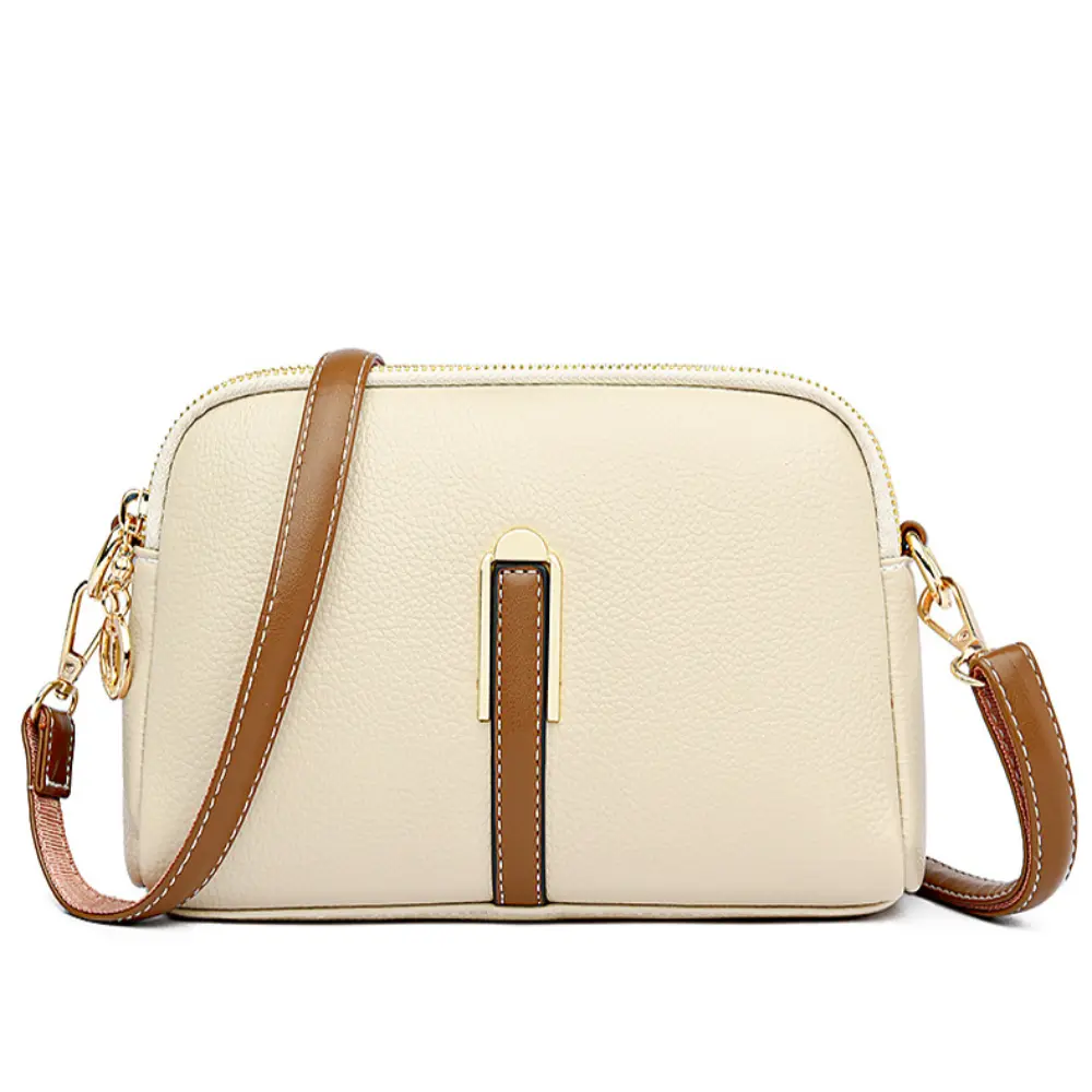 Sac bandoulière en cuir texturé beige clair à bandoulière marron, fermeture zippée