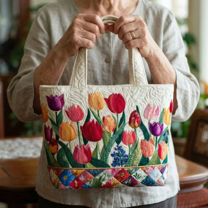 Sac cabas crème à fleurs colorées, anses renforcées et couture froncée.