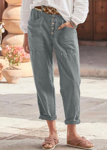 Pantalon élégant gris, taille boutonnée et poches, coupe 7/8.